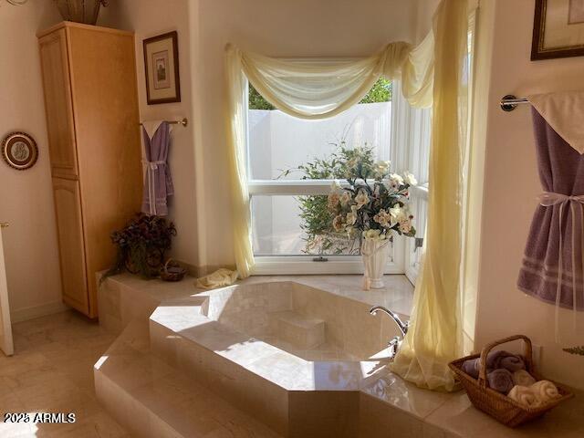 bathroom featuring a garden tub