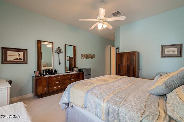 bedroom with visible vents, light carpet, a ceiling fan, baseboards, and lofted ceiling