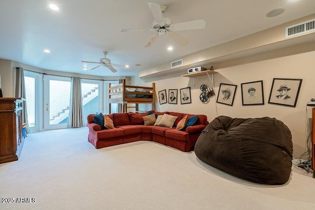 carpeted living room featuring visible vents, recessed lighting, and ceiling fan