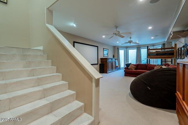 interior space with recessed lighting, a ceiling fan, and carpet flooring