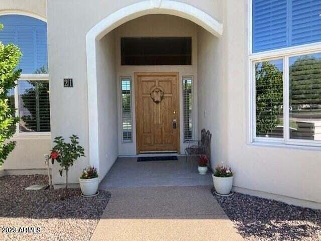 doorway to property with stucco siding