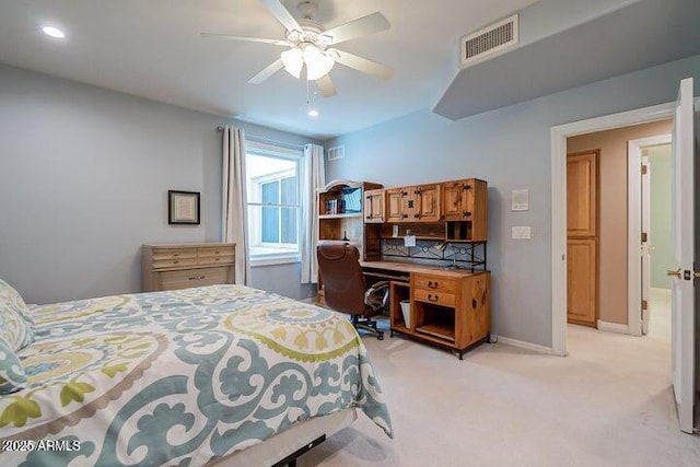 bedroom with recessed lighting, visible vents, light carpet, and baseboards