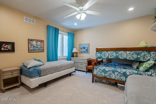 carpeted bedroom featuring recessed lighting, visible vents, and a ceiling fan