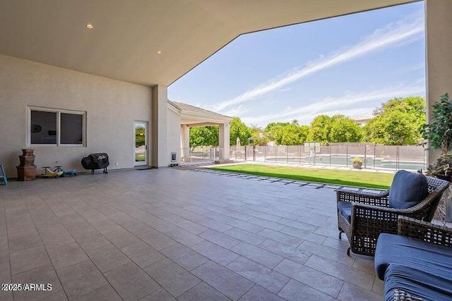 view of patio / terrace featuring fence