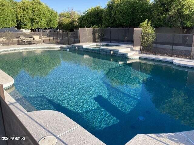 view of pool featuring a patio, a fenced in pool, and fence