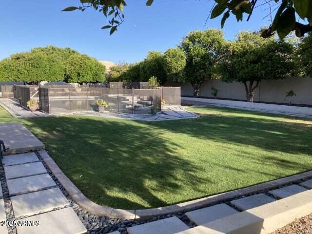 view of yard with a fenced backyard