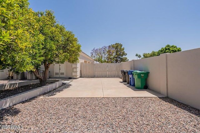 view of yard with a patio and fence