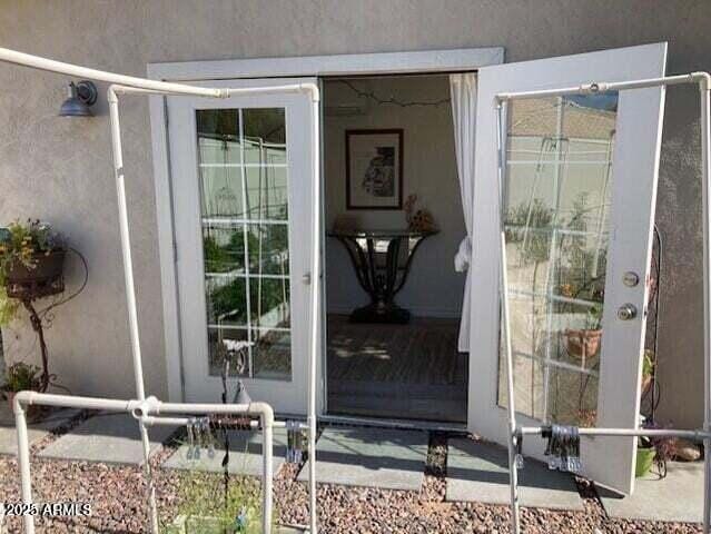 doorway to property with stucco siding