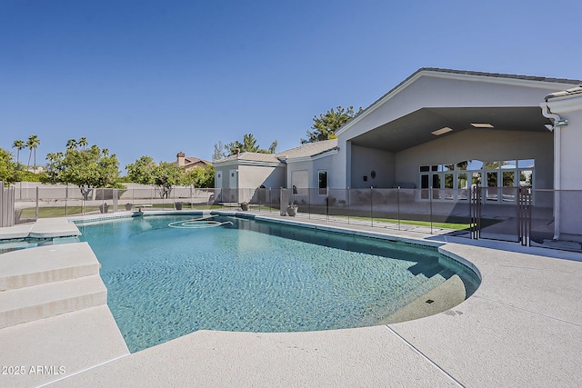 view of swimming pool with a patio, a fenced in pool, and fence