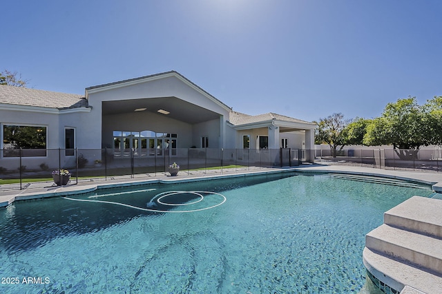 view of swimming pool featuring a fenced in pool, a patio, and fence