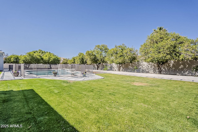 view of yard featuring a patio, a fenced backyard, and a fenced in pool