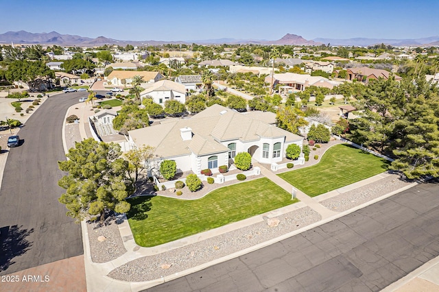 aerial view with a mountain view and a residential view