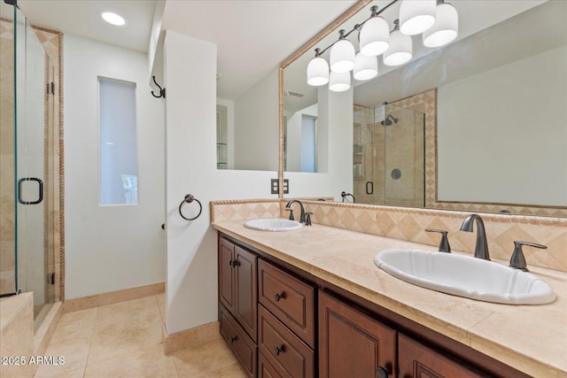 2313 S Grandview Ave, Tempe, AZ 85282 - bathroom featuring a shower stall, double vanity, tile patterned flooring, and baseboards