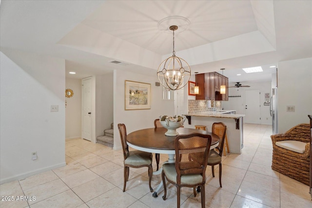 2313 S Grandview Ave, Tempe, AZ 85282 - dining area featuring stairway, a raised ceiling, light tile patterned flooring, a chandelier, and recessed lighting
