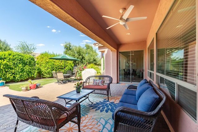 view of patio / terrace featuring ceiling fan and an outdoor living space