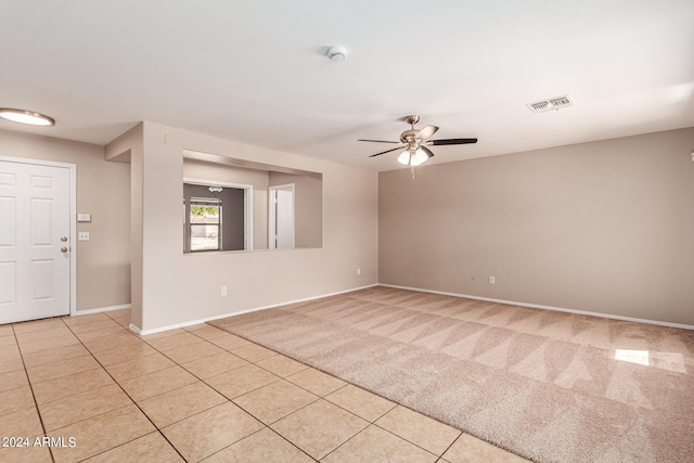 unfurnished room featuring ceiling fan and light tile patterned flooring