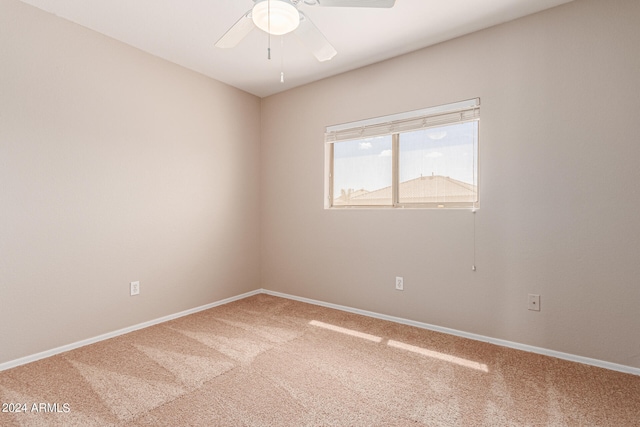 carpeted empty room with ceiling fan