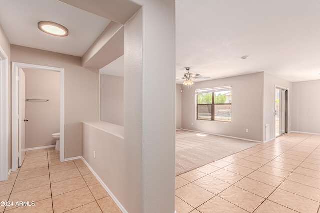 corridor with light tile patterned floors