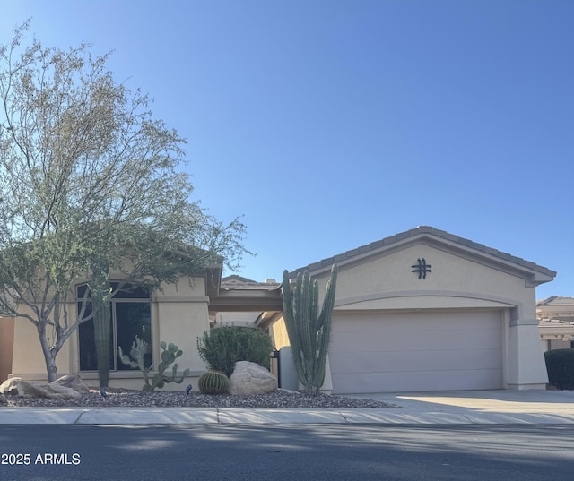 41603 N Cedar Chase Rd, Anthem, AZ 85086 - view of front of property featuring stucco siding, a garage, and concrete driveway