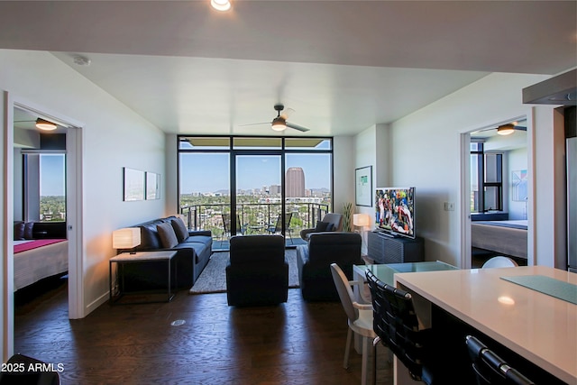 200 W Portland St Unit 1024, Phoenix, AZ 85003 - dining room with a ceiling fan, a wall of windows, dark wood-type flooring, and baseboards