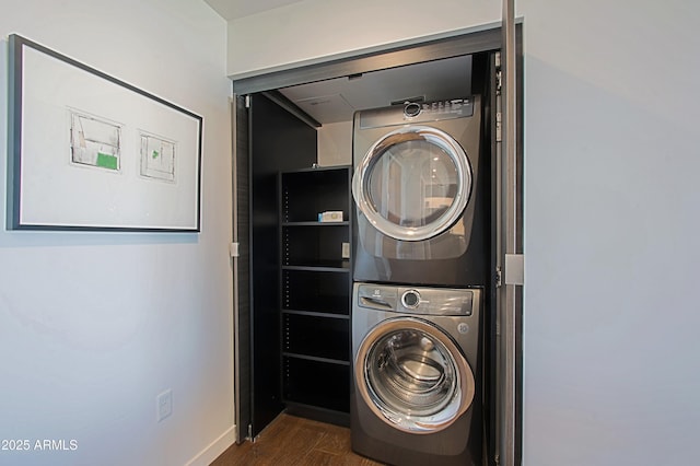 200 W Portland St Unit 1024, Phoenix, AZ 85003 - washroom featuring stacked washer and clothes dryer, wood finished floors, and baseboards