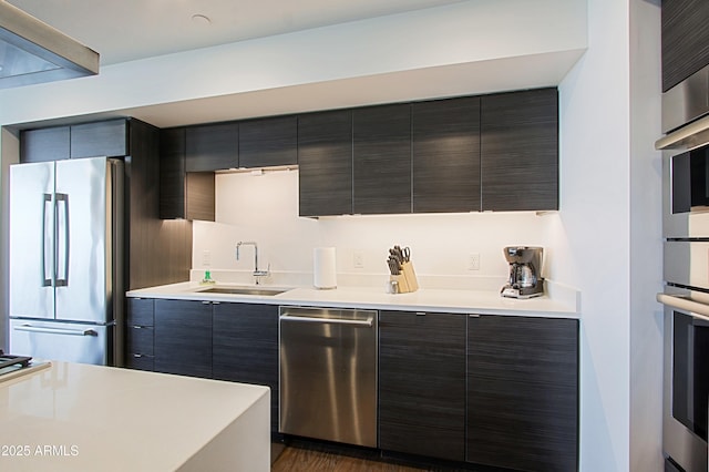 200 W Portland St Unit 1024, Phoenix, AZ 85003 - kitchen with stainless steel appliances, a sink, modern cabinets, and light countertops
