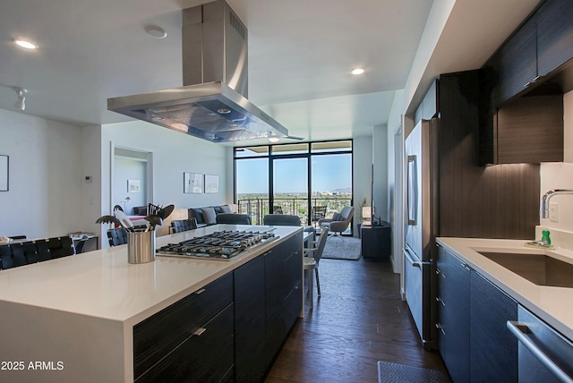 200 W Portland St Unit 1024, Phoenix, AZ 85003 - kitchen featuring island exhaust hood, a sink, stainless steel appliances, open floor plan, and dark wood-style floors