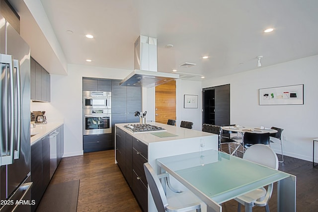 200 W Portland St Unit 1024, Phoenix, AZ 85003 - kitchen with modern cabinets, appliances with stainless steel finishes, a center island, dark wood-style flooring, and light countertops