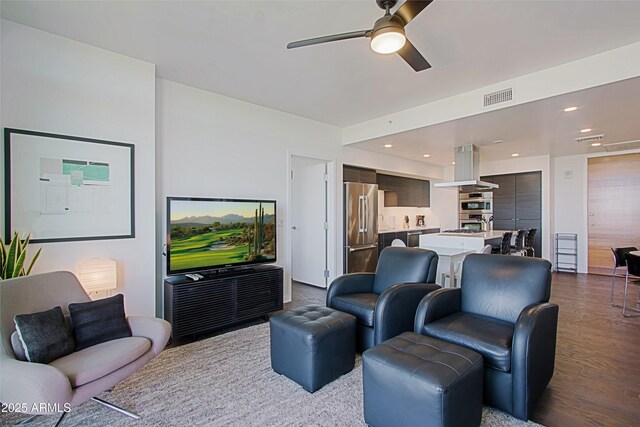 200 W Portland St Unit 1024, Phoenix, AZ 85003 - living room with a ceiling fan and dark wood-type flooring