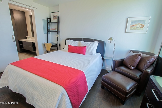 200 W Portland St Unit 1024, Phoenix, AZ 85003 - bedroom with wood finished floors and ensuite bathroom