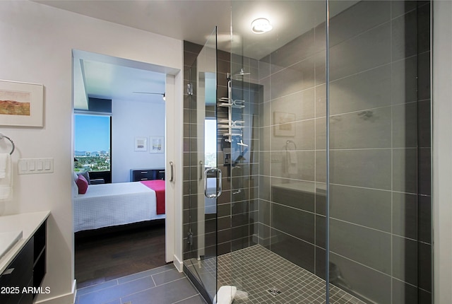 200 W Portland St Unit 1024, Phoenix, AZ 85003 - ensuite bathroom with a shower stall, vanity, and tile patterned flooring