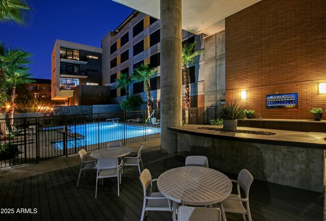 200 W Portland St Unit 1024, Phoenix, AZ 85003 - pool at twilight with a community pool and outdoor dining space