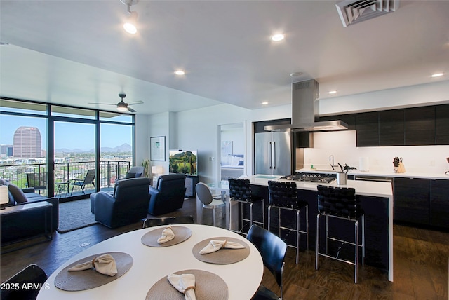 200 W Portland St Unit 1024, Phoenix, AZ 85003 - dining room with dark wood finished floors, a ceiling fan, floor to ceiling windows, and recessed lighting