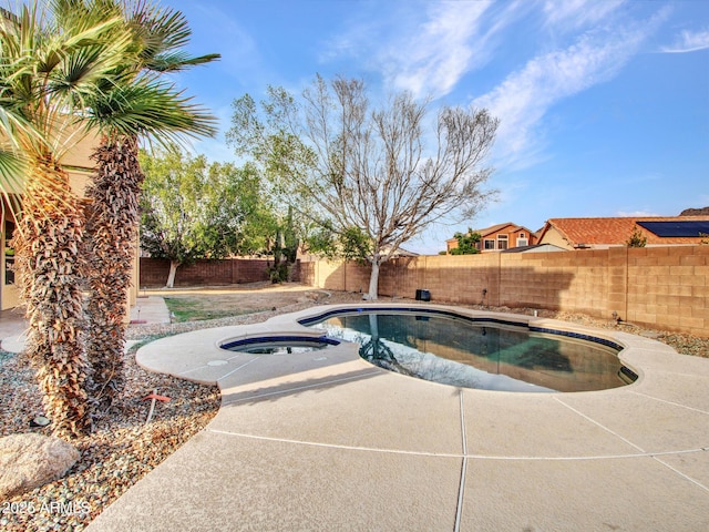 view of swimming pool with a fenced in pool, a fenced backyard, a patio area, and an in ground hot tub