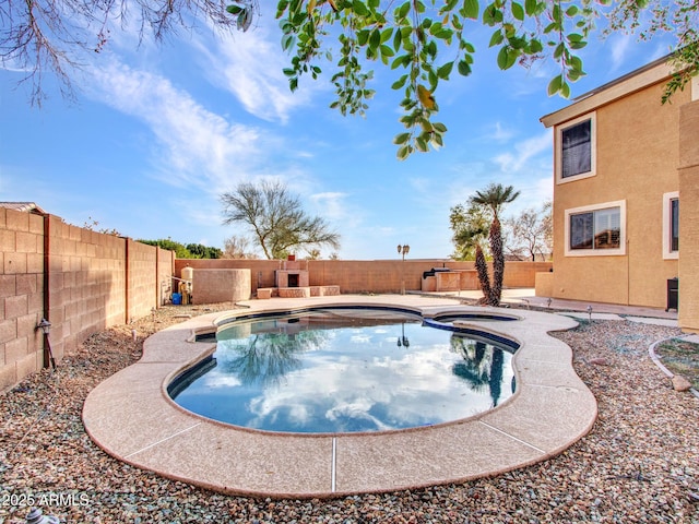 view of pool with a fenced backyard