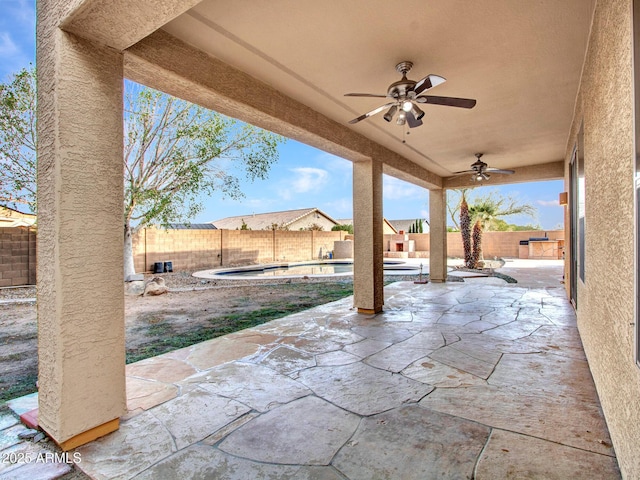view of patio / terrace featuring a fenced in pool, a fenced backyard, and a ceiling fan