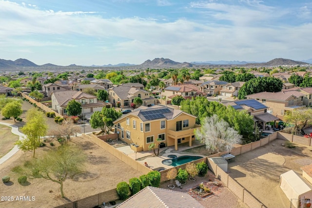 birds eye view of property with a mountain view and a residential view