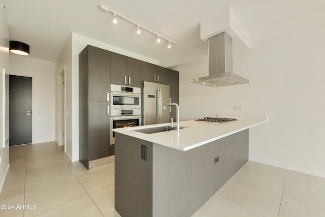 7120 E Kierland Blvd Unit 316, Scottsdale, AZ 85254 - kitchen with extractor fan, a sink, appliances with stainless steel finishes, a peninsula, and light tile patterned floors