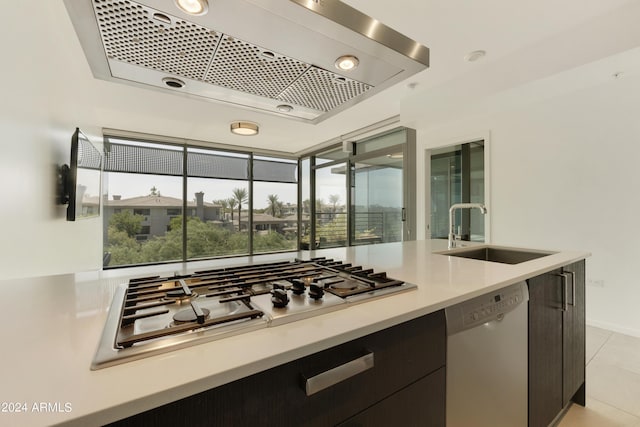 7120 E Kierland Blvd Unit 316, Scottsdale, AZ 85254 - kitchen with dishwashing machine, a sink, range hood, stainless steel gas cooktop, and light tile patterned flooring