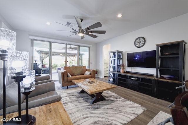 living room with recessed lighting, wood finished floors, visible vents, and a ceiling fan