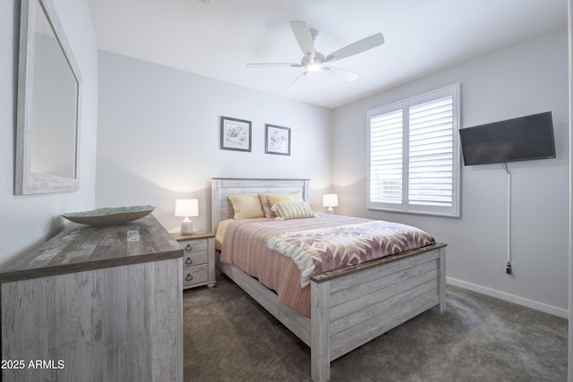 bedroom featuring a ceiling fan, dark carpet, and baseboards