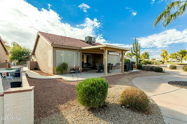 back of house featuring central AC and a patio