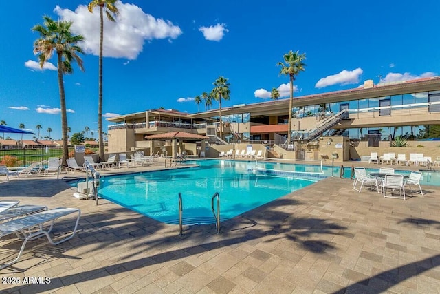 view of swimming pool featuring a patio area