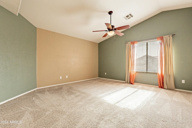 unfurnished room featuring carpet flooring, ceiling fan, and vaulted ceiling