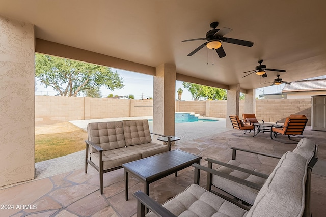 view of patio featuring an outdoor hangout area and a fenced in pool