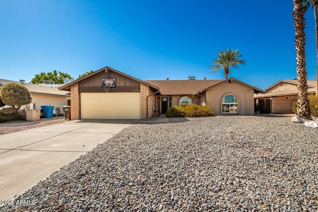 16814 N 31st Ave, Phoenix, AZ 85053 - ranch-style home featuring a garage, concrete driveway, and brick siding