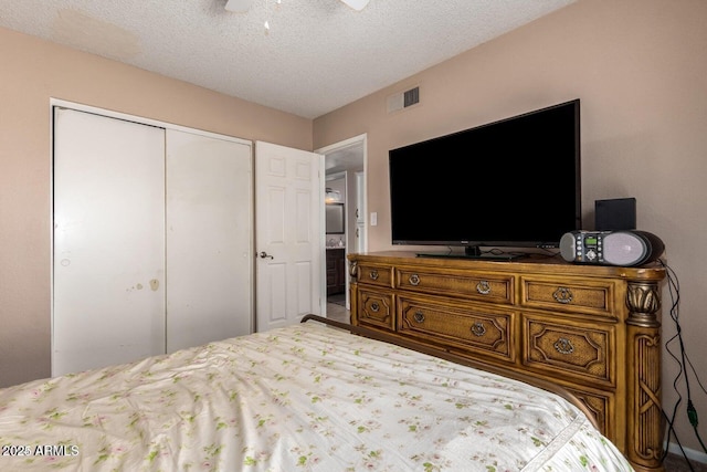 16814 N 31st Ave, Phoenix, AZ 85053 - bedroom featuring a ceiling fan, a textured ceiling, visible vents, and a closet