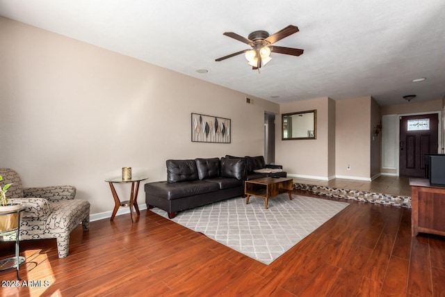 16814 N 31st Ave, Phoenix, AZ 85053 - living area featuring baseboards, a ceiling fan, wood finished floors, and visible vents