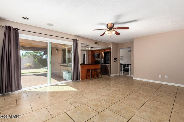 16814 N 31st Ave, Phoenix, AZ 85053 - unfurnished living room featuring a ceiling fan and light tile patterned floors