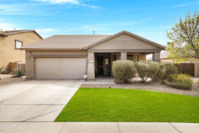 view of front of home featuring a garage, fence, driveway, stucco siding, and a front lawn